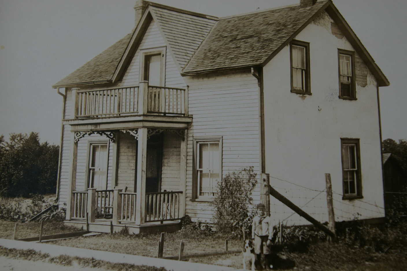 Archival photograph of an old Newmarket house, representing the catalogue of house stories